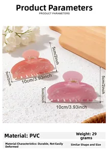 Macro shot of pink translucent shark hair clip showing 10cm size and PVC material texture