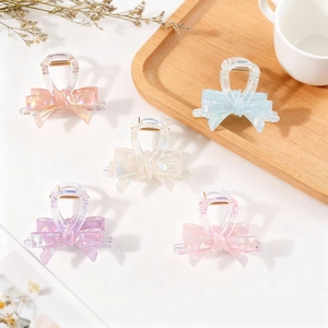 Elegant jelly-colored bow hair claws in pink, blue, and purple with iridescent finish