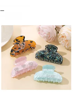Detailed view of French vintage hair claws with rhinestones in diverse colors