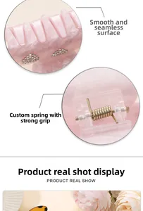 Detail of pink marble acetate hair claw with rhinestones and high-grip metal spring