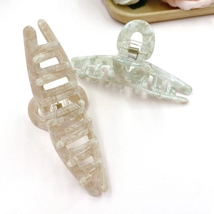 Large marble-pattern hair claw clip in beige and mint green for thick hair