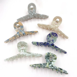 Set of six large marble pattern hair claw clips in various stylish acetate colors