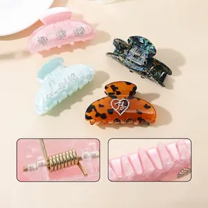 French vintage hair claw clips set in marble green, amber, and rhinestone patterns