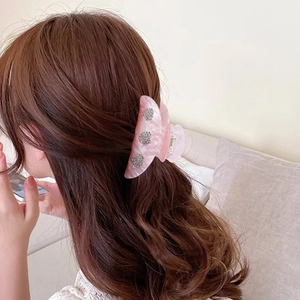 Pink marble pattern acetate hair claw clip with crystal heart accents for women