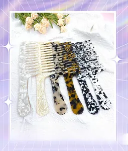 Detailed collection of long-handle cellulose acetate wide-tooth combs in leopard and marble patterns