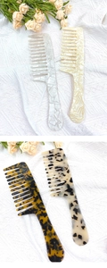 Close-up of leopard acetate wide-tooth hair combs in various colors and patterns