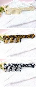 Detailed close-up of wide-tooth cellulose acetate hair combs in various marble and tortoiseshell patterns