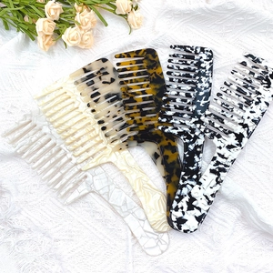 Elegant leopard print acetate wide-tooth combs with long curved handles for curly hair