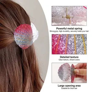 Colorful shell-shaped hair claw clip with glitter finish and strong metal spring