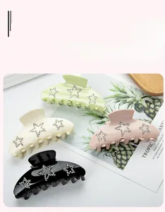 Detail of 9cm hair claw clips with star-shaped rhinestone pattern in four colors