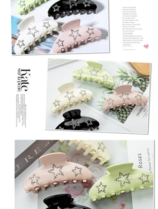 Detail view of large 9cm hair claws in four colors with sparkling rhinestone stars
