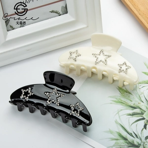 9cm minimalist hair claws with rhinestone stars in elegant black and cream white finish