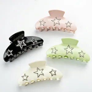Set of 4 hair claw clips in pastel colors with sparkling rhinestone star decorations