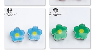 Detailed close-up of 2cm floral hair clips in sky blue and emerald green resin finish
