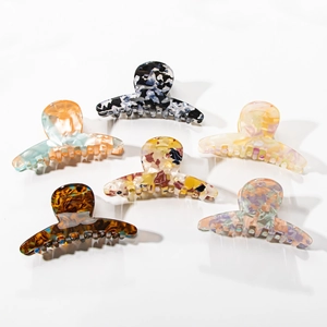 Set of 6 colorful PVC claw clips with unique marble and floral patterns for women hair