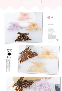 Detailed macro view of butterfly-shaped hair claws in assorted marble acetate finishes
