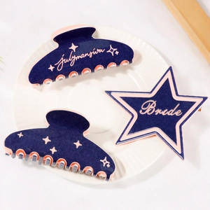Navy blue hair claw clips and star hairpin set with pink 'July Mansion' text