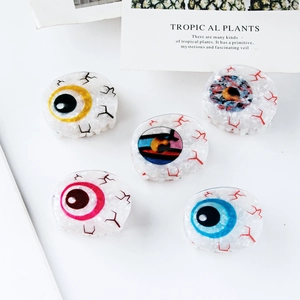 Pinces à cheveux amusantes en acétate avec motifs yeux colorés sur fond blanc