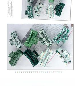 Detail view of 8-piece St. Patrick's Day green clover hair claw clips with various patterns