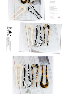 Macro shot of U-shaped hair pins showing tortoiseshell and marble acetate patterns