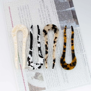 Set of four tortoiseshell and leopard print U-shaped hair pins in acetate for bun hairstyles
