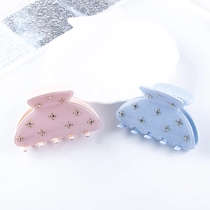 Lot de deux pinces à cheveux mates en rose et bleu avec des accents de strass brillants