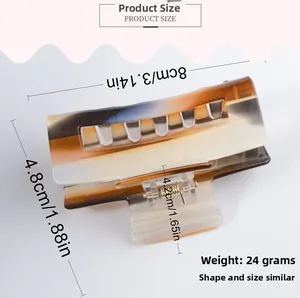 Close-up of 8cm striped acetate hair claw clip showing brown and grey gradient pattern