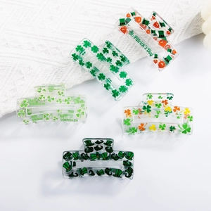 Five St. Patrick's Day themed hair claws with green clover and hat patterns
