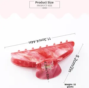 Detailed view of large marble texture hair claw clip with clear size measurements