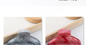Close-up of 11cm acrylic hair claw clips in mica grey and carmine red marble patterns