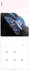 Macro detail of 9cm deep blue translucent claw clip with sparkling crystal rhinestone inlay