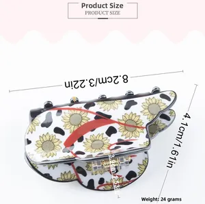 Detail showing dimensions of butterfly hair claw clip with cow print and sunflower patterns