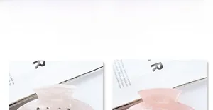 Close-up of semi-transparent acetate hair claws with sparkling rhinestones in light pink and white
