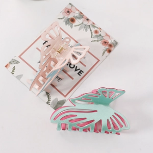Dual-color glitter butterfly hair claw clips in pink, blue, and mint green tones