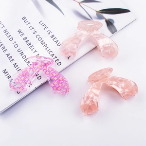 Pink butterfly acetate hair claw clips with floral patterns and marble texture set of 3
