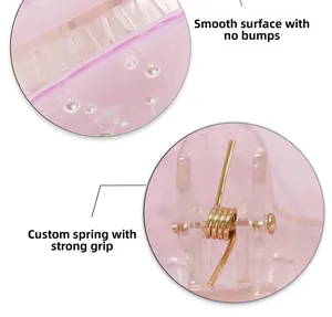 Detail of smooth pink translucent hair claw with a durable custom metal spring