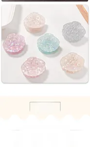 Set of six shell-shaped hair clips with iridescent colors and pearl accents