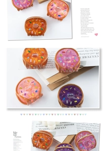 Macro view of multi-colored donut hair claws with colorful sprinkles detail