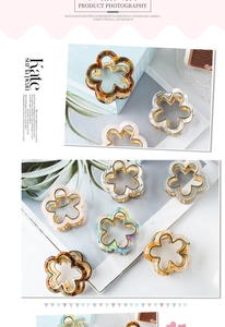 Close-up of floral acetate hair claws in various pearlescent colors with metal springs