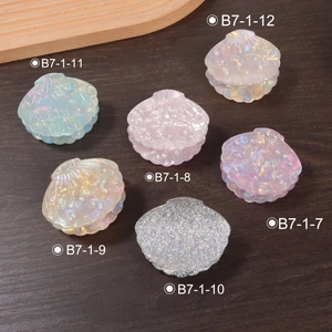 Shell-shaped PVC hair claws with pearl embellishments in six iridescent colors set