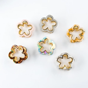 Set of six colorful flower-shaped hair claws made of acetate with metal springs