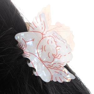 Iridescent angel-shaped hair claw clip with red outlines for women's hair styling