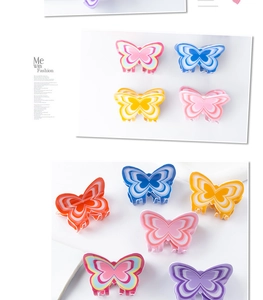 Close-up of butterfly hair claw clip featuring a colorful multi-layered wave pattern design