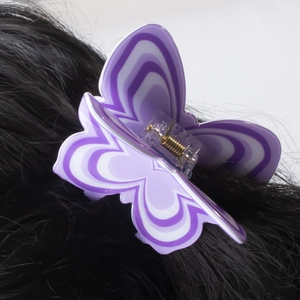 Elegant purple butterfly hair claw clip with wavy patterns on dark hair, 8cm accessory