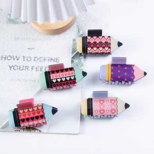 5-piece pencil hair claws with heart and XOXO prints in pastel colors for girls