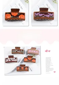 Detailed view of square hair claws with vintage floral prints and leopard patterns