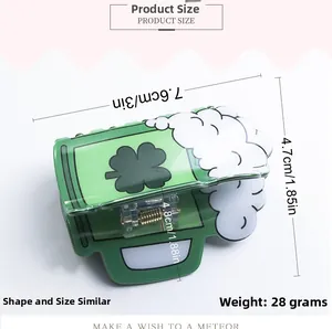 Macro view showing dimensions of a green beer mug hair claw with shamrock pattern