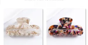 Detail of rectangular hollow PVC hair claws in marble and colorful tortoiseshell patterns