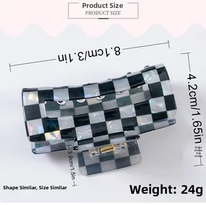 Macro view of large rectangular checkered hair claw clip with product dimensions