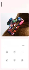 Macro view showing a colorful patterned rectangle hair claw clip on long brown hair